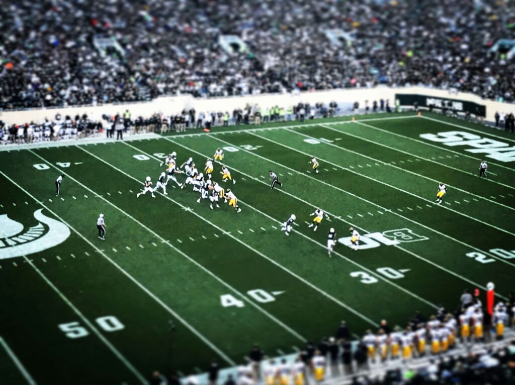 American football field during a televised live TV broadcast