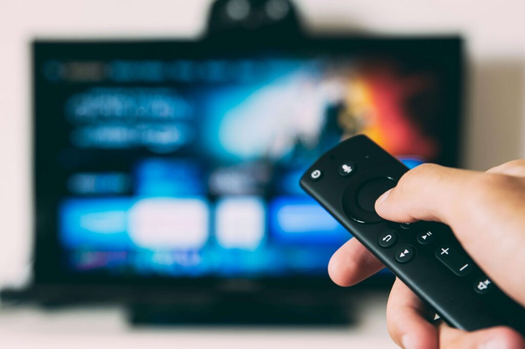 Family watching a Netflix-style streaming service on a smart TV at home